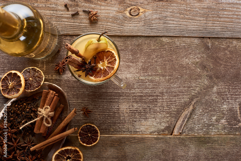 top view of traditional pear mulled wine with spices on wooden rustic table top view of traditional pear mulled wine with spices on wooden rustic table