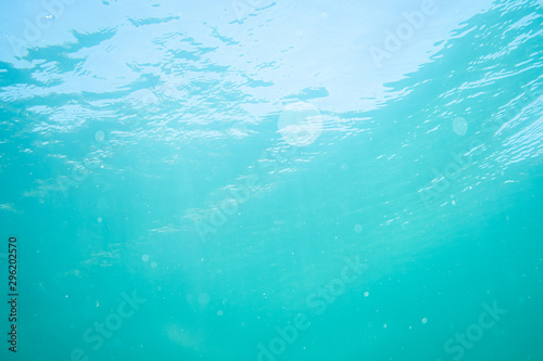 waves on a lake shot form under water, under water photography in a lake in austria