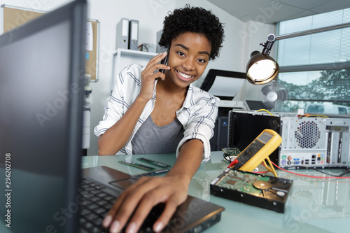 female technician repairing a computer