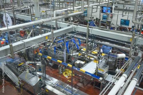 Production of dairy products. Plant, factory in operating mode. Automation of production, conveyors