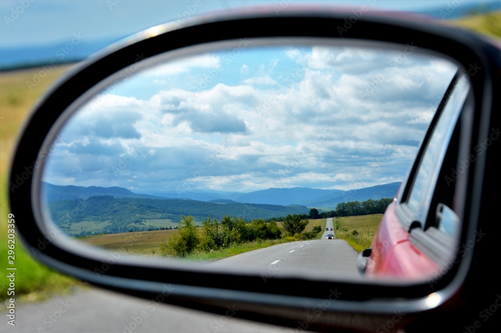 landscape seen through the rearview mirror landscape seen through the rearview mirror