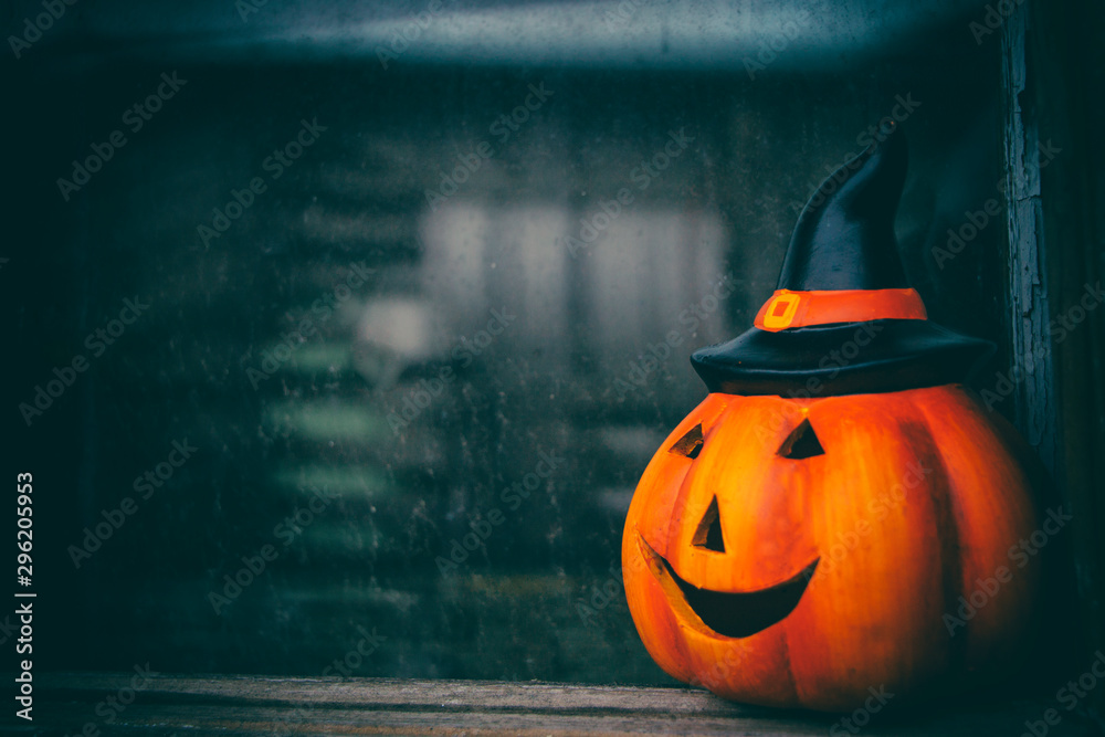 Halloween pumpkin on dark window glass background Stock Photo | Adobe Stock