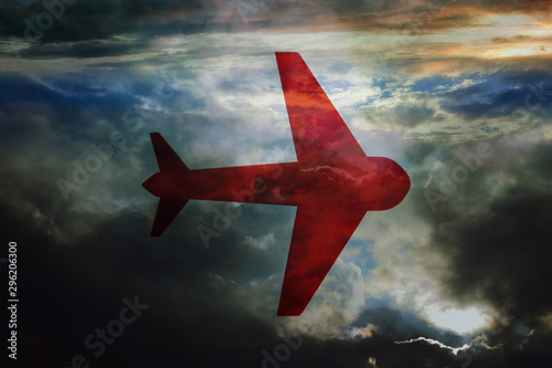 Red bomber plane icon flies high in the dark clouds at night. Bombing raid on ground targets.