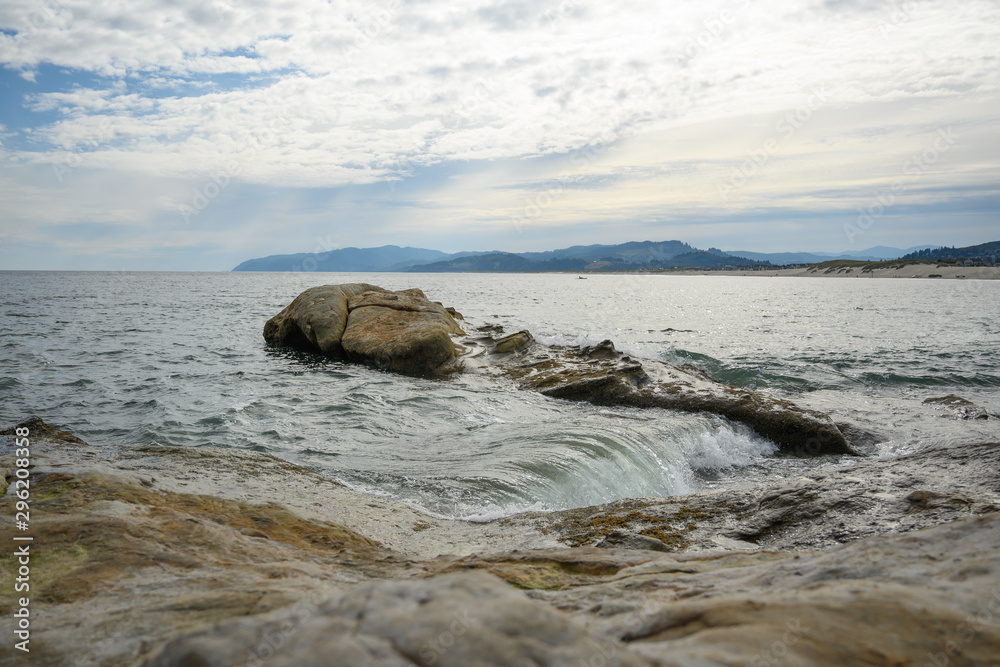 stones in water. waves of the ocean or sea beat against the rocks