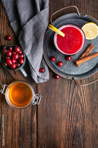 Healthy drink for urinary tract health, homemade cranberry juice with lemon and cinnamon, sweetened with honey with copy space