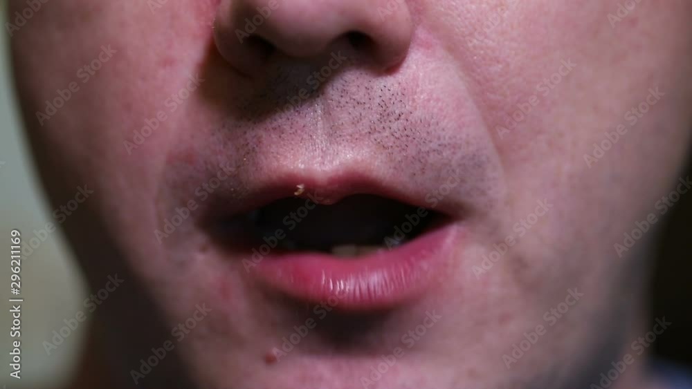 man eats breaded chicken wings. close-up man eats breaded chicken wings. close-up