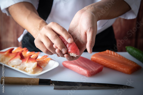 japanese sushi chef making nigiri sushi photo