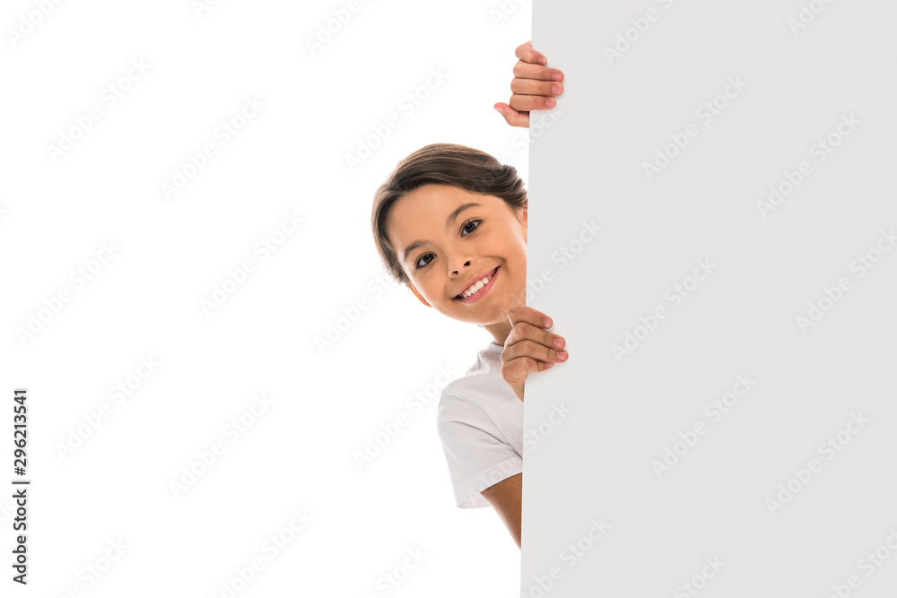 happy child smiling and holding placard isolated on white happy child smiling and holding placard isolated on white