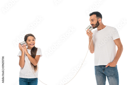 happy kid holding tin can and playing with bearded father isolated on while
