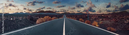 Panel kuchenny z motywem Image related to unexplored road journeys and adventures.Road through the scenic landscape to the destination in Lanzarote natural park