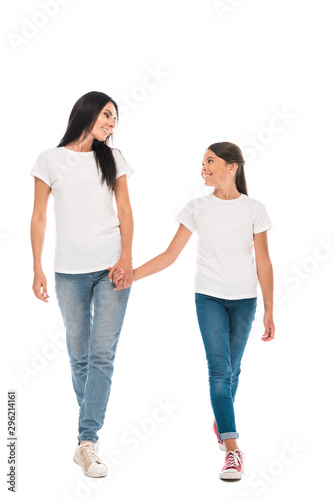 happy mother and daughter holding hands isolated on white
