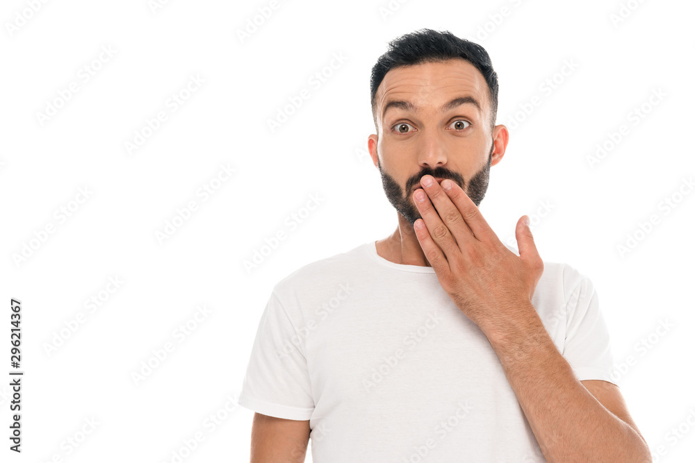shocked young man covering mouth isolated on white