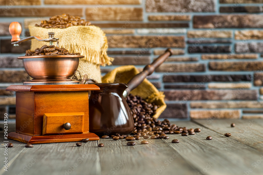 still life with coffee beans and old coffee mill on the wooden