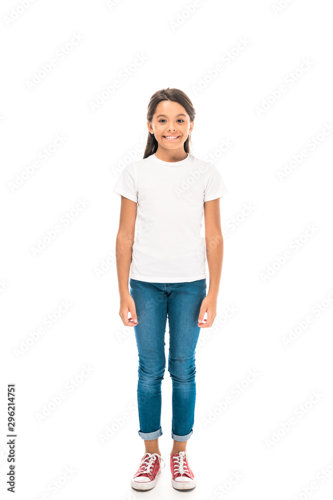 Fototapeta premium happy kid in blue jeans standing isolated on white
