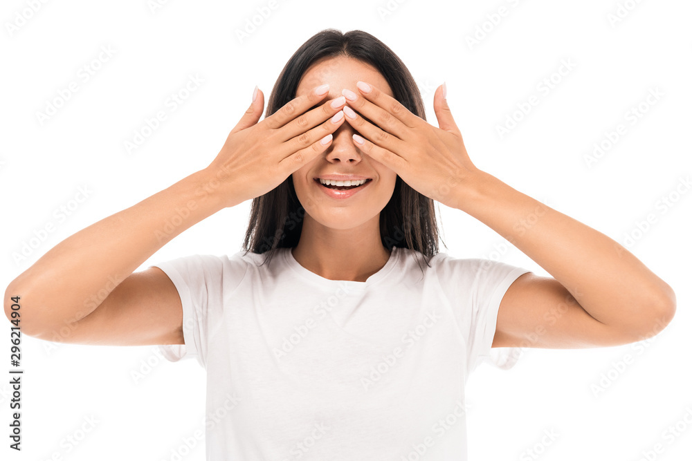 happy young woman covering eyes isolated on white happy young woman covering eyes isolated on white
