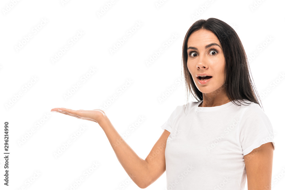 beautiful and surprised woman pointing with hand while looking at camera isolated on white beautiful and surprised woman pointing with hand while looking at camera isolated on white