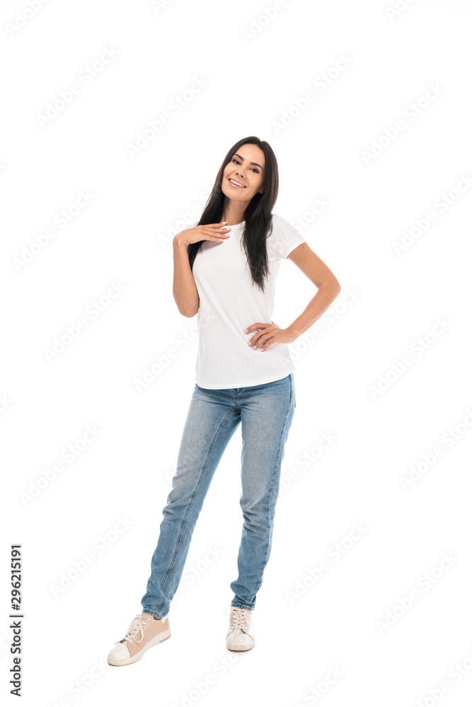 happy woman standing with hand in hip isolated on white happy woman standing with hand in hip isolated on white