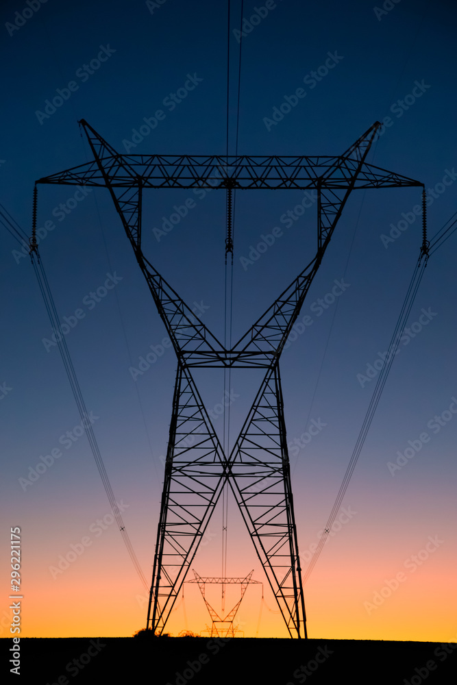 high voltage lines on background of blue sky