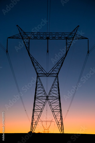 high voltage lines on background of blue sky