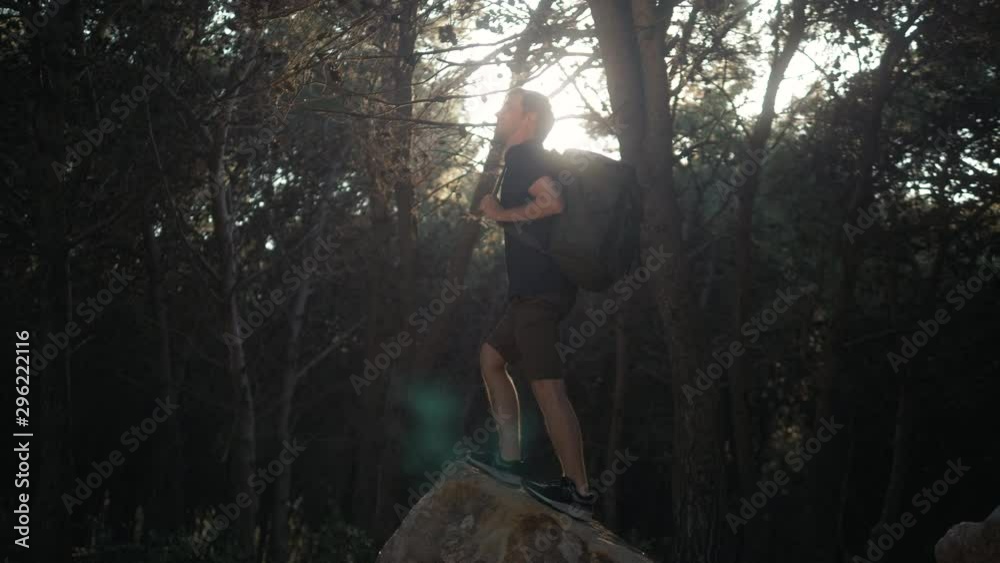 custom made wallpaper toronto digitalYoung man hiker with backpack standing on top of cliff in summer mountains in forest at sunset and enjoying view of nature