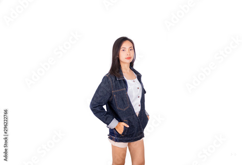 An Asian girl in jeans jacket and shorts posing front of the camera