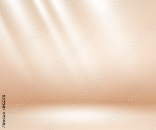Beige studio background. Neutral background with soft rays. Warm soft light studio lighting. Photostudio soft box neutral lighting.