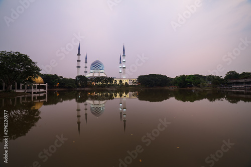 The Sultan Salahuddin Abdul Aziz Shah Mosque or Shah Alam Mosque during hazy sunrise © ZAIRIAZMAL