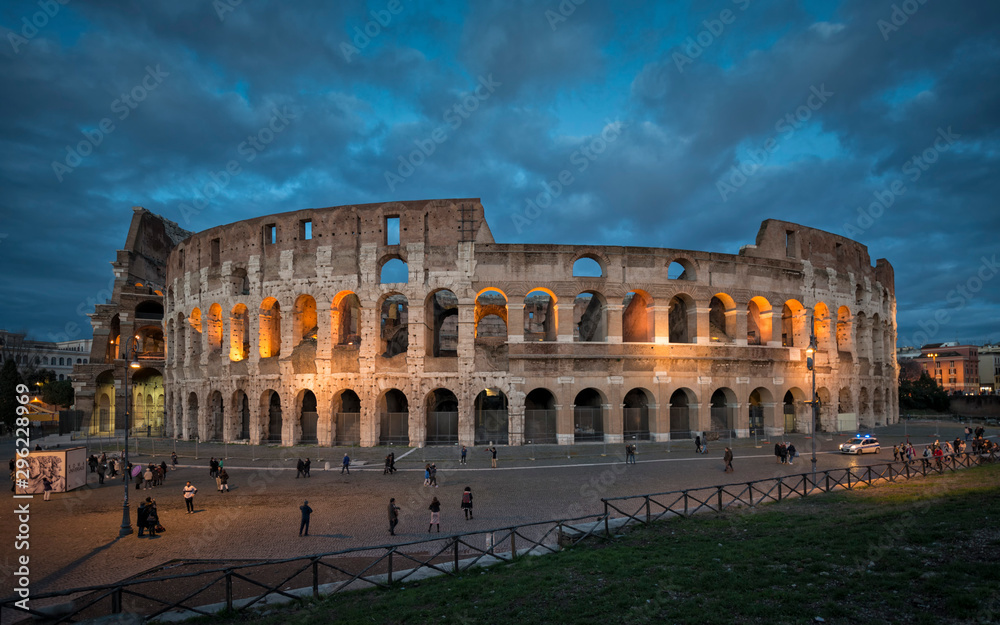 panoramic of the Roman Colosseum illuminated at the blue hour
