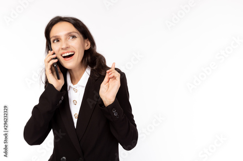 Business woman talking with customer on mobile phone. Attractive beautiful young businesswoman gets happiness, satisfied that client order, buy a lots of goods, smile face. It is good news. copy space