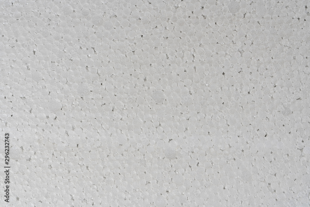 White abstract polystyrene foam background texture close-up detail view. Polystyrene, styrofoam, plastic sheet abstract synthetic packaging material. White abstract polystyrene foam background texture close-up detail view. Polystyrene, styrofoam, plastic sheet abstract synthetic packaging material.