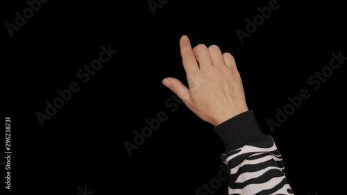 Teenager dressed in zebra print pullower hand touch screen gestures Basic