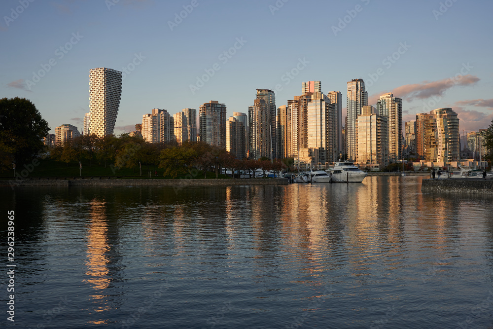 False Creek waterfront buildings and boats during sunset in Vancouver, British Columbia, Canada.