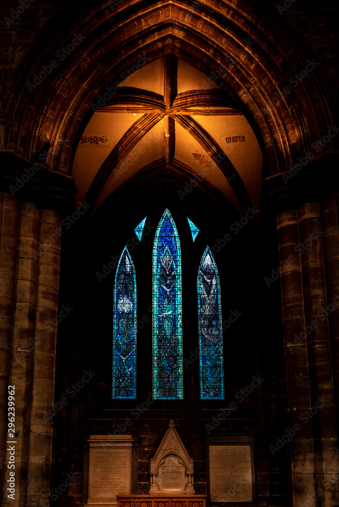 GLASGOW, SCOTLAND, DECEMBER 16, 2018: Stained glass of interiors of Glasgow Cathedral, also known as High Kirk or St. Mungo. An excellent example of Scottish Gothic architecture.