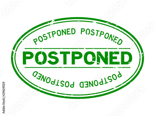 Grunge postponed word oval rubber seal stamp on white background