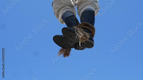 Boots sway in the wind after a hanging. photo