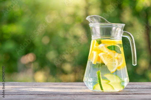 Pitcher of homemade lemonade on wooden table
