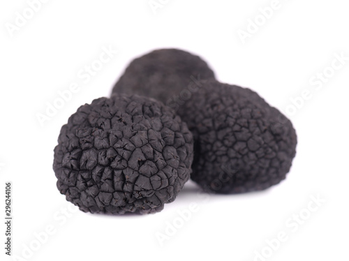 Black truffles isolated on a white background. Delicacy exclusive truffle mushroom. Piquant and fragrant French delicacy. Clipping path.