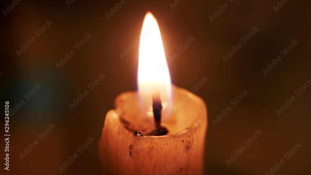 Candle burning in warm dreamy tones Candle burning in warm dreamy tones