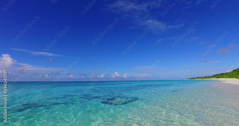 Beautiful blue water ripples onto white sandy beach. Calm, relaxing. Maldives incredible scenery. Beautiful blue water ripples onto white sandy beach. Calm, relaxing. Maldives incredible scenery.