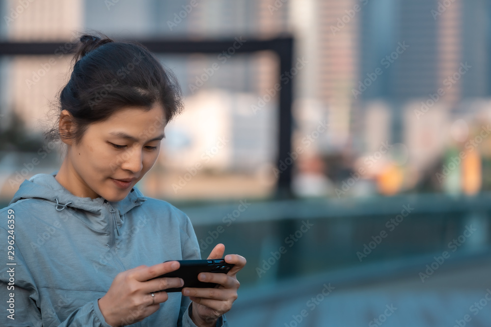 Woman playing mobile game  outdoor