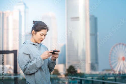 Woman playing mobile game outdoor