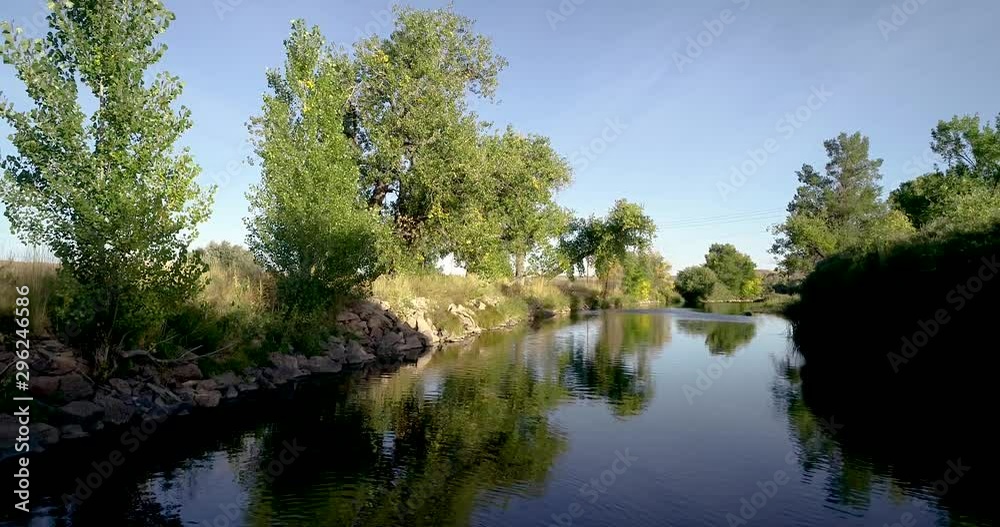 A drone flight with plenty of visual reflections in the water. A drone flight with plenty of visual reflections in the water.