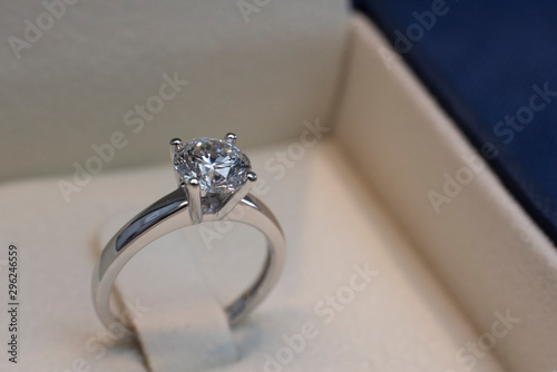 Diamond Jewelry Ring on a blue background. Selling gems concept