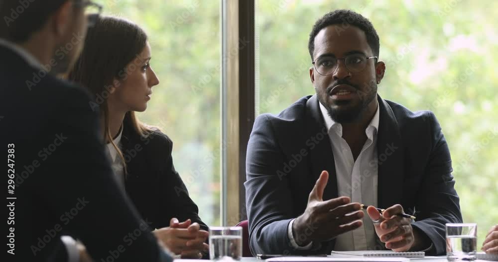 African male leader consulting clients or team explaining project strategy