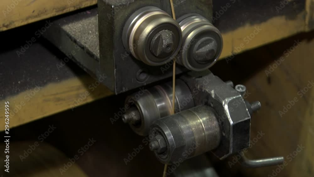 Machines, equipment and coils with wire. Wire production plant. Inside the old factory manufacturing electrical cable. Single core insulated wire copper or aluminum wire. Production of electric cables Machines, equipment and coils with wire. Wire production plant. Inside the old factory manufacturing electrical cable. Single core insulated wire copper or aluminum wire. Production of electric cables