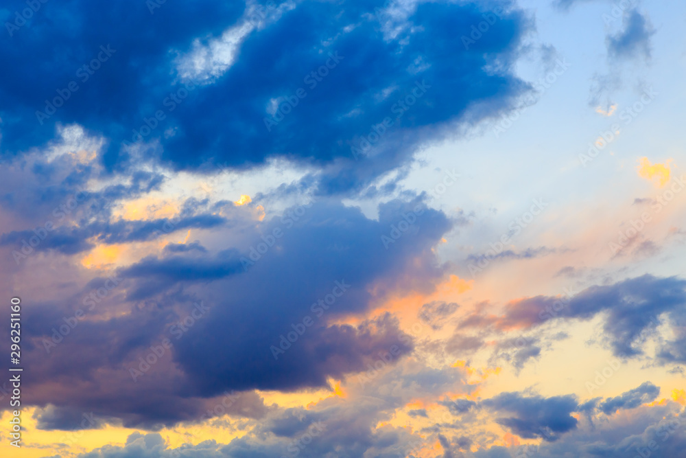 Bright cumulus clouds against the blue sky. Sunset sky Natural background