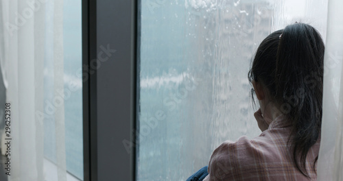 woman cry near by window