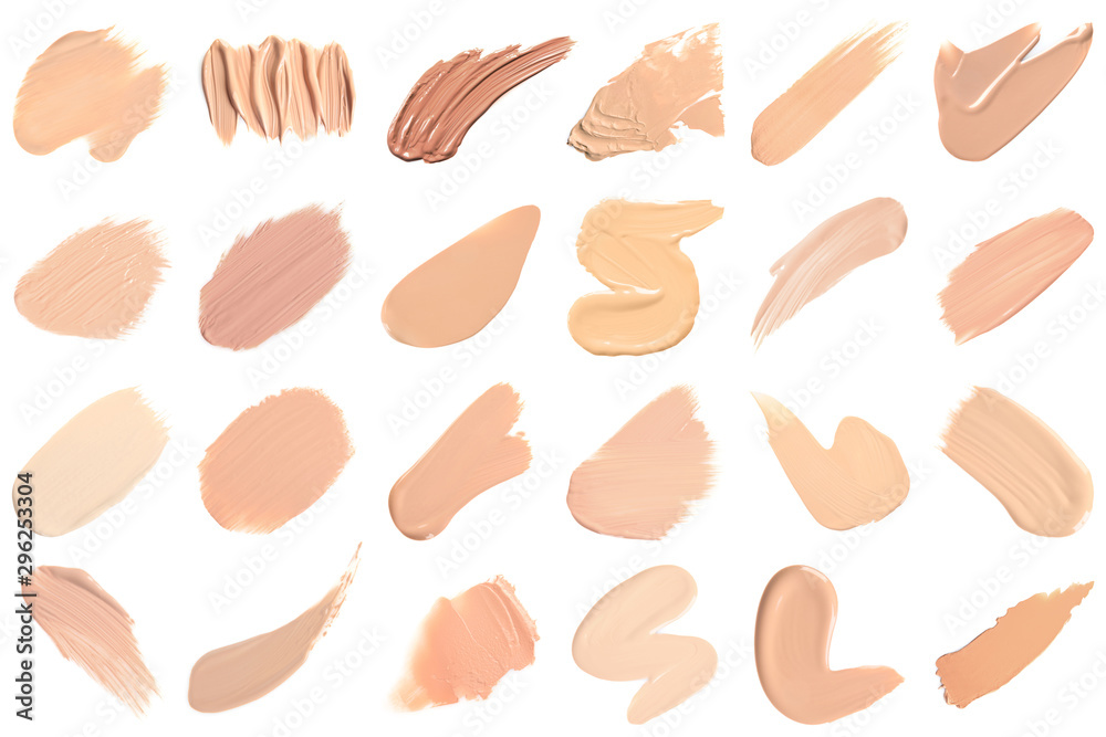 Set of different foundation shades on white background, top view Stock