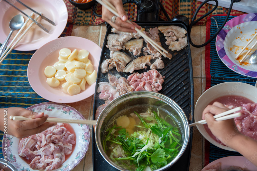 Cooking Pork grilled on the stove and broth in the pot Flavored with seasonings Cubed with chopsticks Delicious Asian food Cooking Pork grilled on the stove and broth in the pot Flavored with seasonings Cubed with chopsticks Delicious Asian food