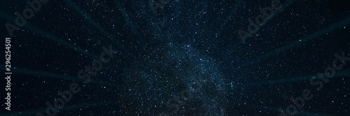 Black star hole with rays on a starry space panoramic sci-fi background. Elements of this image furnished by NASA.